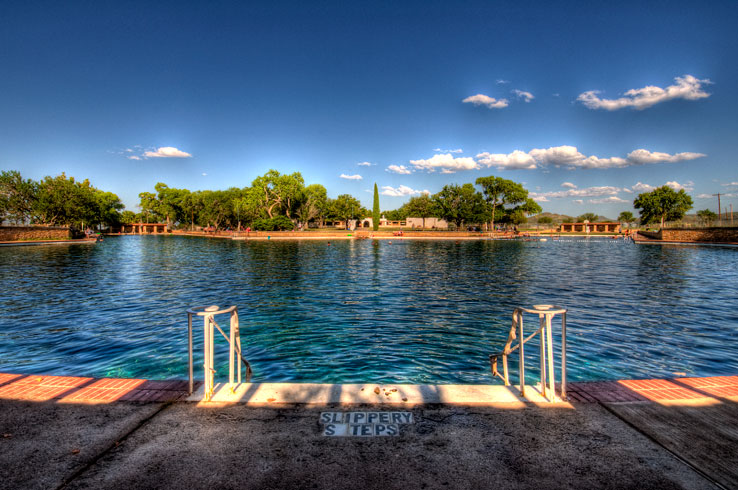 Dive into the crystal clear waters of Balmorhea State Park's swimming pool, the largest spring-fed pool in the world. 