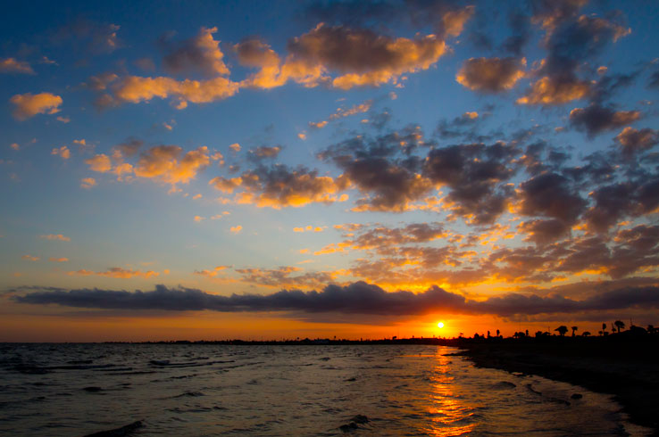 A stunning sunset at Rockport Beach, one of the top beaches on the Texas Gulf Coast.