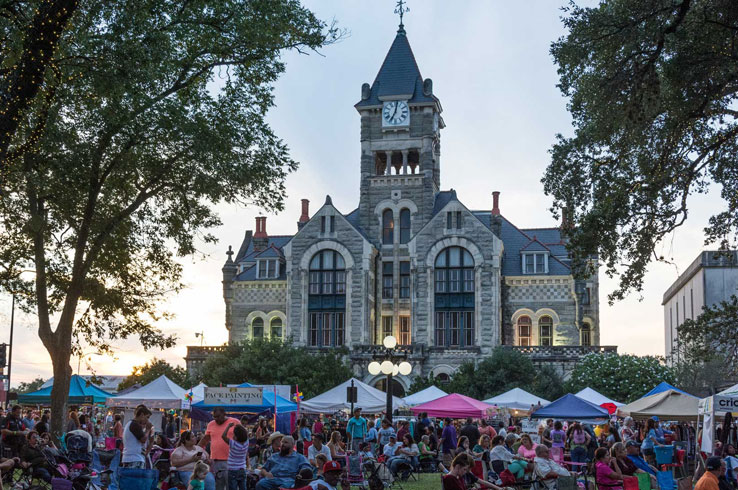 The stunning 1892 Victoria County Courthouse looms over the square in downtown Victoria.