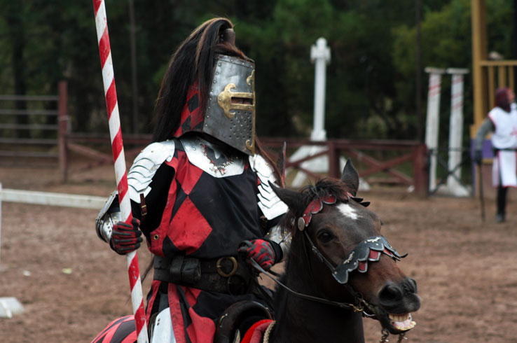 A knight riding horseback prepares for a jousting performance at the Texas Renaissance Festival in Todd Mission.