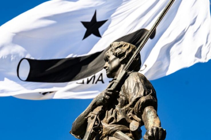 Come and Take It flag and statue