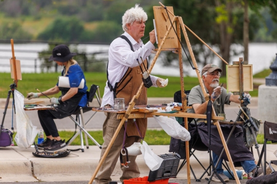 man painting outdoors