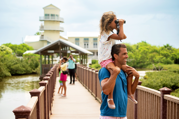 family on pier